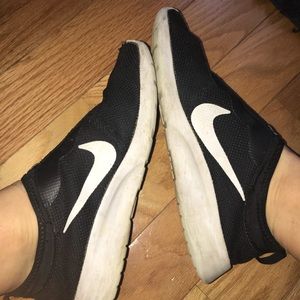 Black slip-on Nike sneakers